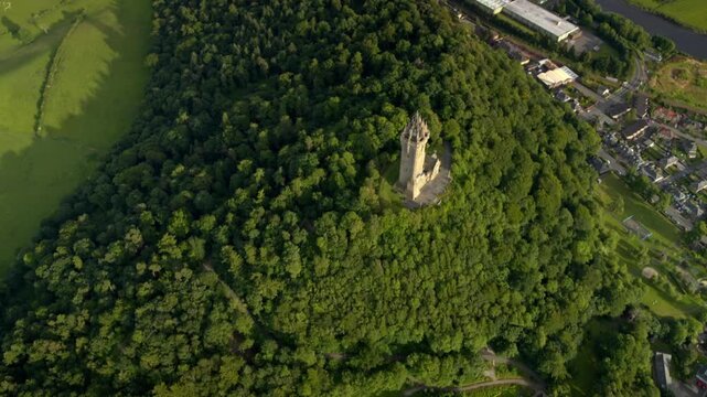 Beautiful aerial orbit shot of the famous National Wallace Monument on Abbey Craig, near Stirling