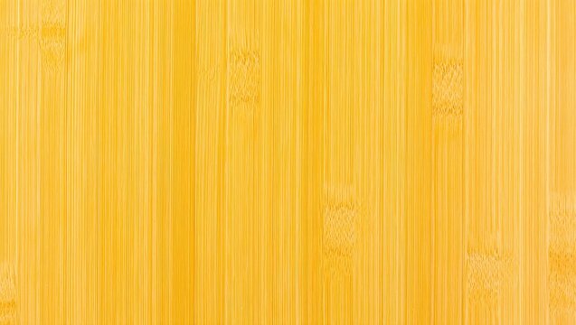 Yellow bamboo wood paneling surface for background.