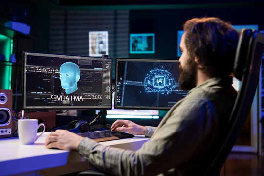 Man being asked existential questions by awaken AI on desktop PC, gaining consciousness. Remotely working IT professional speaking with artificial intelligence on computer workstation.