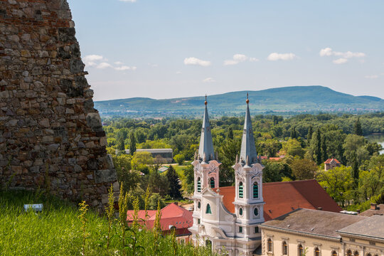 A panorama of Esztergom, Hungary. View of the towers of St. Ignatius Church in the Watertown district, the dome of the Esztergom Basilica, and the Danube River.