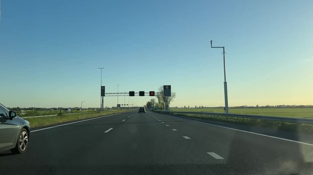 Amsterdam Netherlands highway, Wide highway with light traffic at sunset