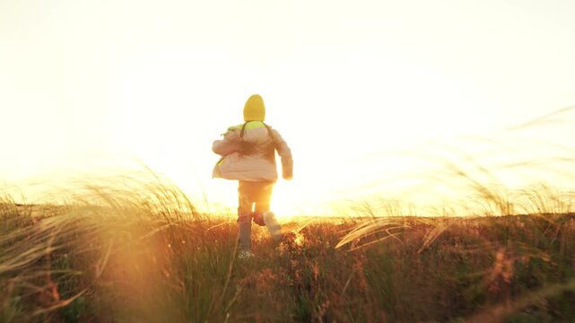 small child kid girl daughter runs across spring field sunset, child runs nature park, cheerful child kd schoolboy runs outdoors, airplane pilot dream, superhero runs nature sunset, girl jacket plays