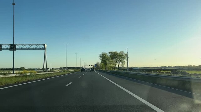Amsterdam Netherlands highway, Multi lane highway traffic with cars and truck under clear sky