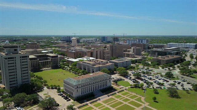 Drone view of College Station Texas campus district with lawns parking lots and cranes