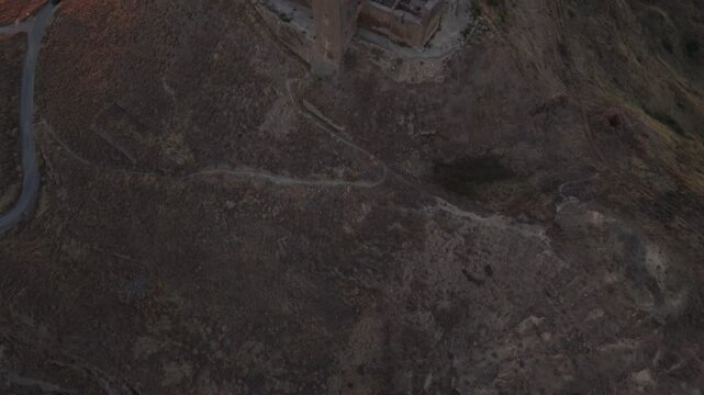 Aerial view of the medieval Montearag&oacute;n Castle near Huesca, Aragon, Spain, showing the historic fortress ruins in a rural mountain landscape.
