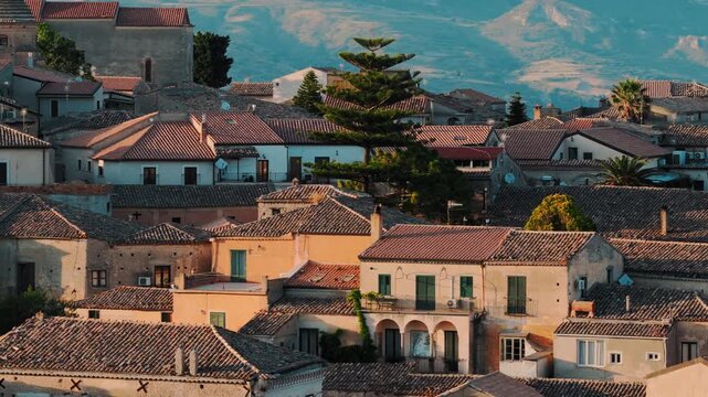Houses and churches in the rural village of Gerace, panoramic view at sunset