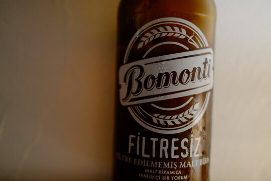 Cesme, Turkey &ndash; June 15, 2026 &ndash; Bomonti Filtresiz beer bottle close-up