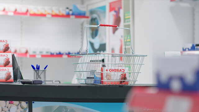 Empty pharmacy checkout counter with boxes of medicine, selling modern pills or pharmaceutical drugs on shelves in drugstore clinic, medical supplies are for sale along with other treatments.