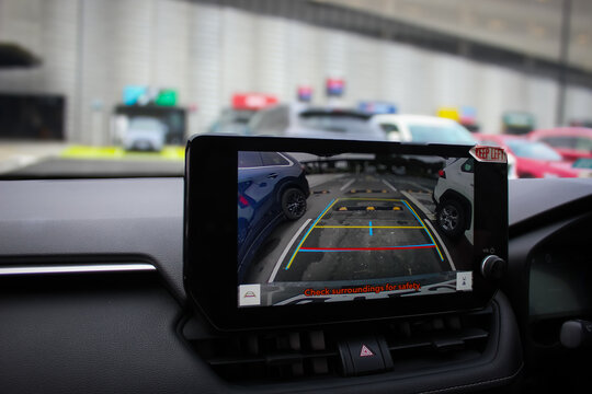 Car rearview camera interface on dashboard screen: Automotive technology with blurred background (Auckland, New Zealand - Mar 12, 2026). For Editorial use only.