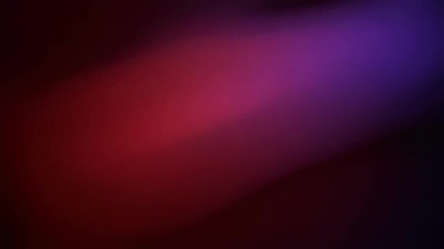 Abstract colorful gradient background with smooth blend of red purple and dark tones for digital design
