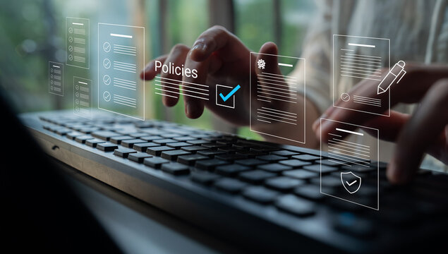 A professional engages in digital policy management, typing on a keyboard surrounded by floating icons representing documents and strategies in a modern office setting. Cyphers