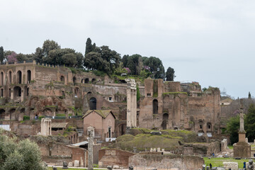 Fototapeta premium Architectural history in details of ruins, old buildings, walls, amfitheatres, arches in old part of Rome, dated from 300 BC, guided tours in Rome, Italy
