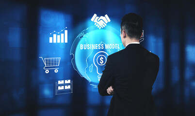 Naklejka premium Business Professional Analyzing Global Business Models and Data Visualizations in a Modern Office Environment Quark.
