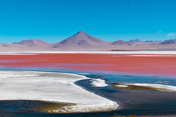 Scenic view of Laguna Colorada red lake with volcanos and flamingos, Eduardo Avaroa Andean Fauna National Reserve, Bolivia. © Kevin