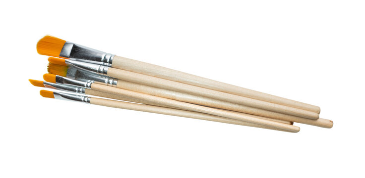 Paintbrushes with orange bristles and wooden handles isolated on transparent background art supplies and painting tools