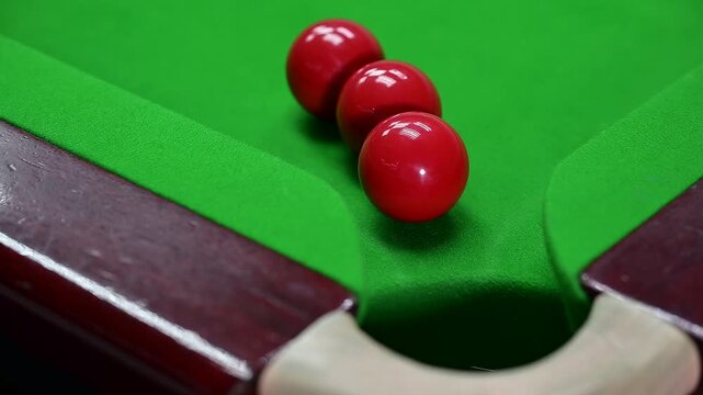 Snooker Cue Ball Striking Three Red Balls and Potting a Red Ball. 