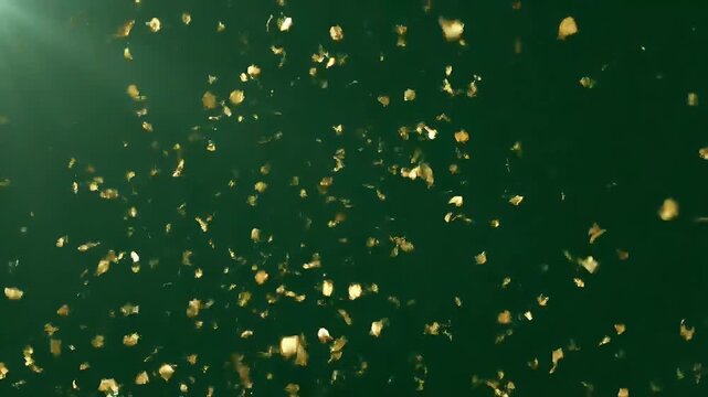 Gold confetti falling on a dark green background for festive celebration and luxury event design