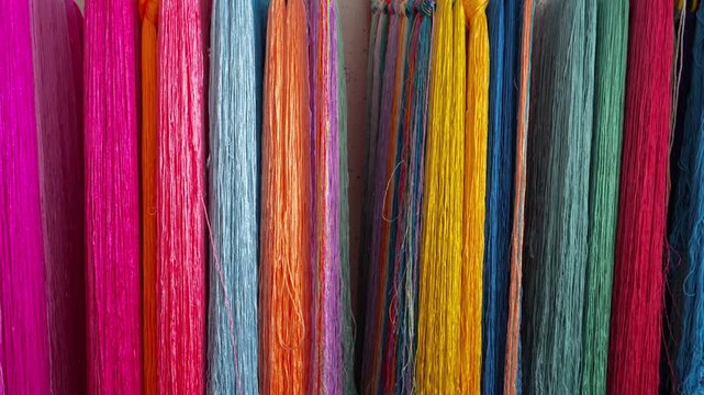 Close-up of colorful silk embroidery threads on traditional Qiang ethnic embroidery work in Sichuan, China