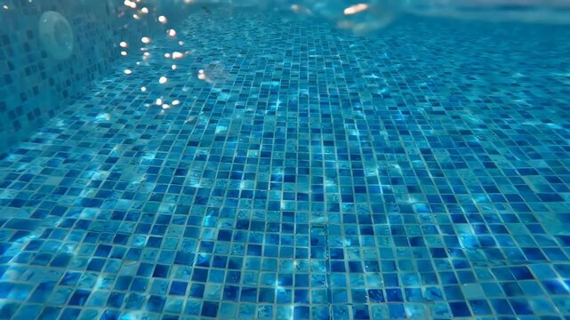 Tranquil atmosphere of clear blue swimming pool water reflecting sunlight vibrant tiles, showcasing shimmering floor and inviting light reflections