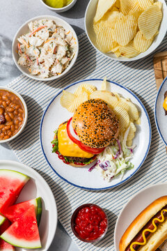 Homemade Cheeseburger with Barbecue Food and Sides