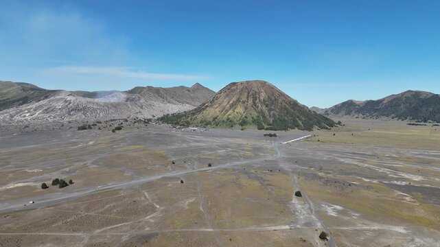 Aerial view of the sea of sand with volcanic complex in Bromo Tengger Semeru National Park located in East Java of Indonesia.