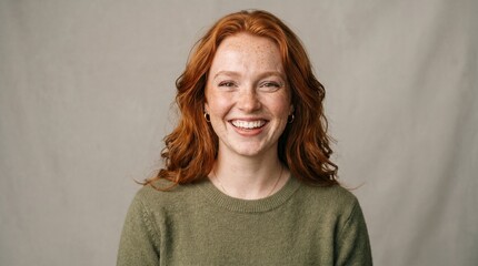 Obraz premium Portrait of a Smiling Young Redhead Woman with Freckles and Ginger Hair in Studio