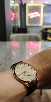 BANGKOK, THAILAND - APRIL 15 : Jaeger leCoultre Master Ultra Thin Collection with 18k gold case and alligator strap, round dial, small second, with ultra luxury gold precious case, wear on wrist, in B