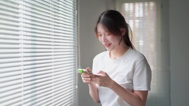 Young asian woman playing with fidget spinner toy