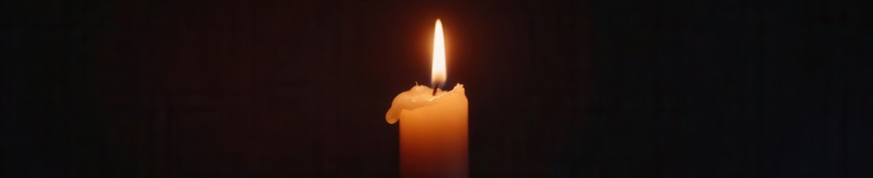 Flickering candle flame extinguishes, leaving dark void , macro, black