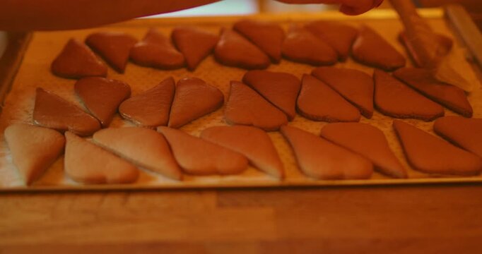 Traditional heart shaped gingerbread cookies on a baking sheet prepared for glazing in Prague Czech Republic