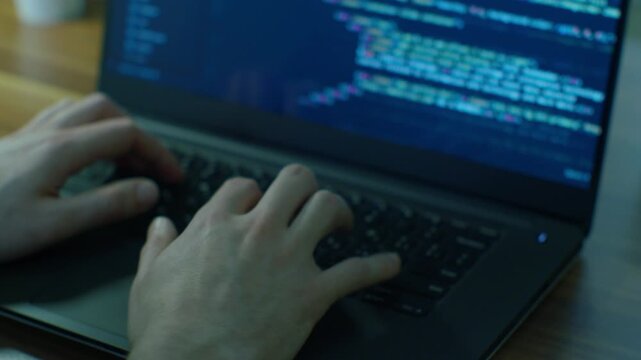 Full Stack Developer Hands Coding HTML5 and Web Programming on Laptop Screen in 4K Ultra HD footage
