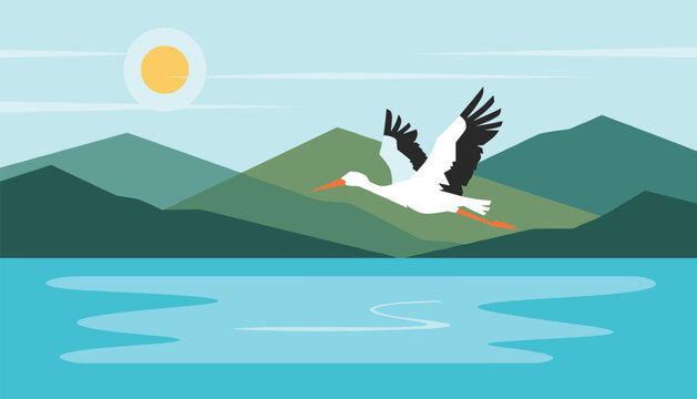 Majestic white stork flying gracefully over a calm blue lake with green mountain ranges and sunset in the background.