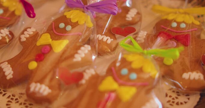 Cute decorated gingerbread men cookies packaged in plastic bags at a traditional shop in Prague Czech Republic