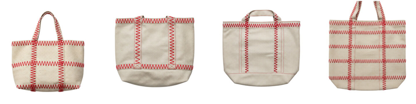 Four beige canvas tote bags with red zigzag stitching isolated on black