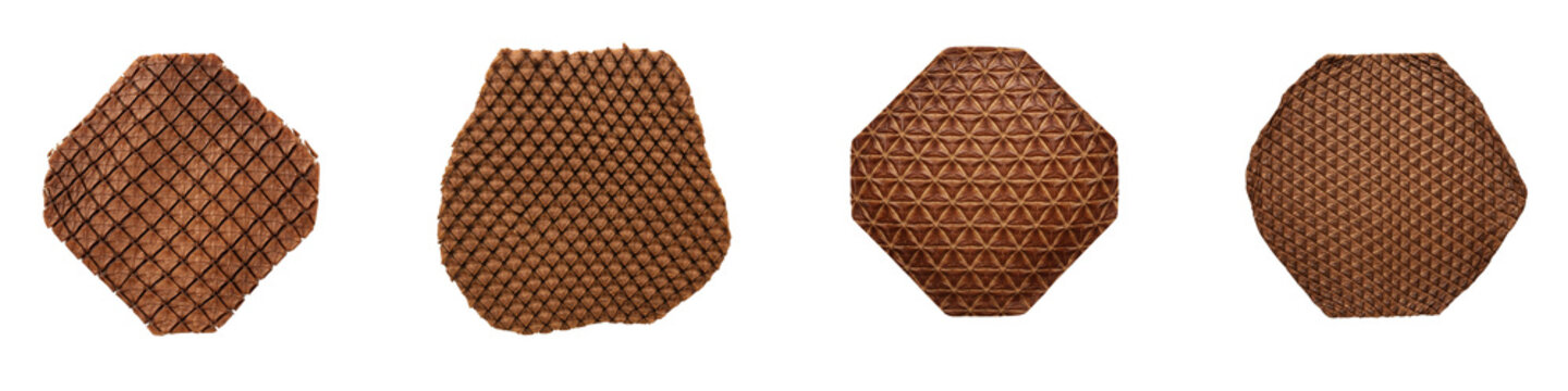 Four brown leather origami shapes with geometric patterns on black background