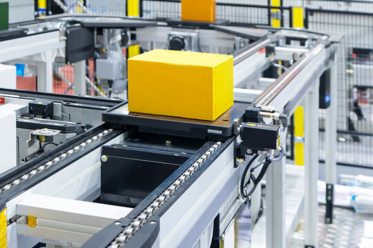 The machinery system for delivering goods in the material warehouse with a sliding mechanism, in a focus view on the sliding equipment.