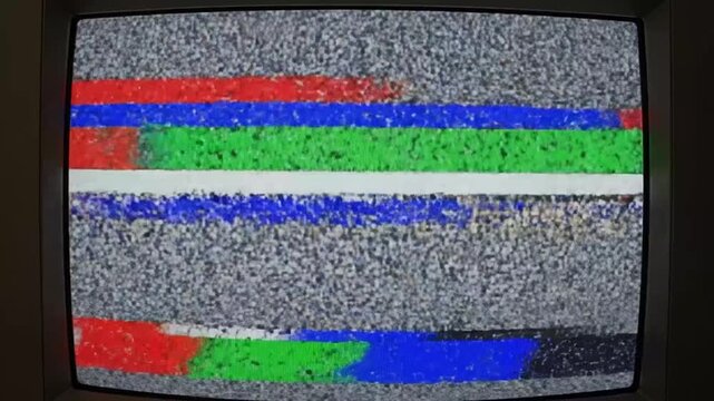 Static television screen with colorful bars.