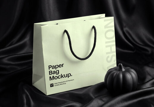Paper Shopping Bag Mockup on Black Silk Fabric Background