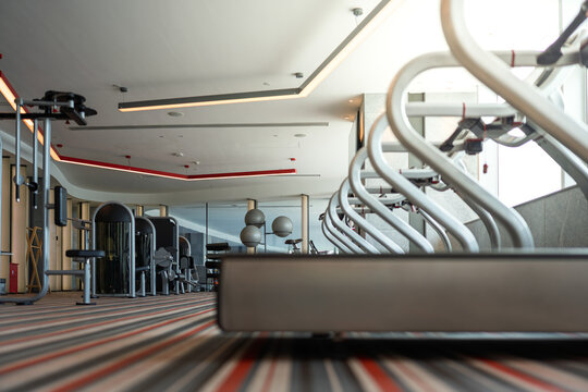 Modern premium gym interior with arranged fitness equipment scene