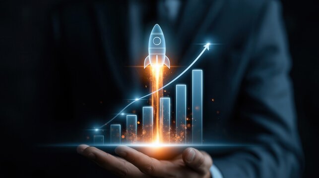 Businessman holds a holographic rocket ship launching over a rising financial graph to symbolize huge growth.