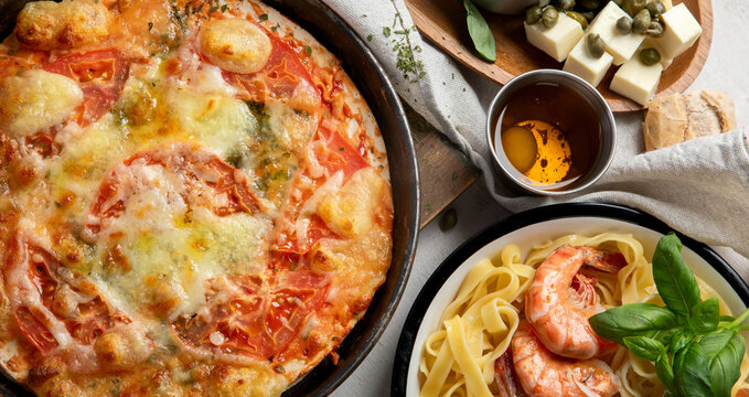 Italian cuisine. Pasta, pizza, olives and antipasto toasts.