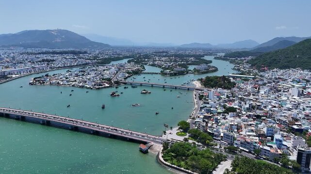 Aerial view of Cau Tran Phu and Cau Xom Bong bridges across Cai river in Nha Trang city, Vietnam.