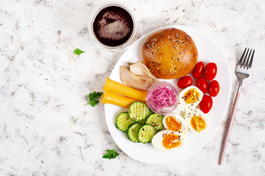 Healthy Breakfast Plate with Eggs Cheese Fish and Fresh Vegetables. Top view