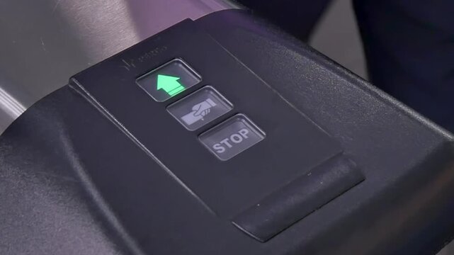Witness how modern ticketing machine simplifies travel. Traveler interacts with buttons, making choices and using their card. This process showcases convenience in busy environment efficiency matters.