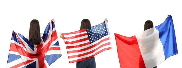 Obraz premium A woman joyfully waves UK, USA, and France flags while exploring vibrant places, PNG