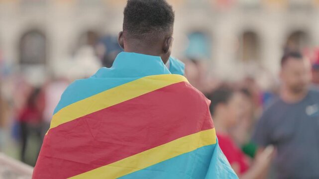Football supporter wearing democratic republic of congo flag