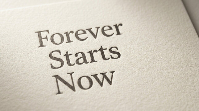 Inspirational quote Forever Starts Now printed on textured paper, motivational message on elegant cream cardstock, romantic wedding or life beginning concept