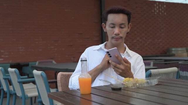Thai Non-Binary Gay Man Taking Photo of Dim Sum Lunch with Phone Horizontal Shot