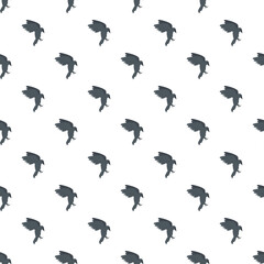 Fototapeta premium Flying dark bird silhouette creating a seamless patterned background