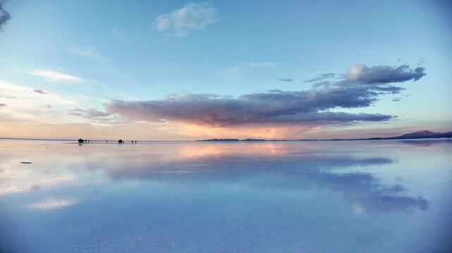 Salar de Uyuni Salt Flat Sunset with Water Reflection and Tourists in Bolivia